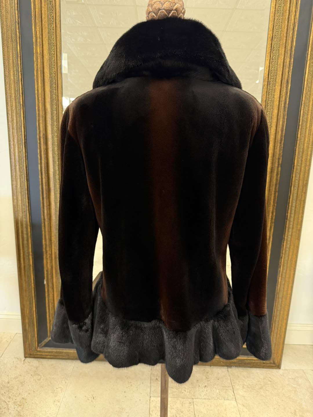 Black sheared mink with golden highlights and natural long haired mink ruffled front, hem line, and cuffs