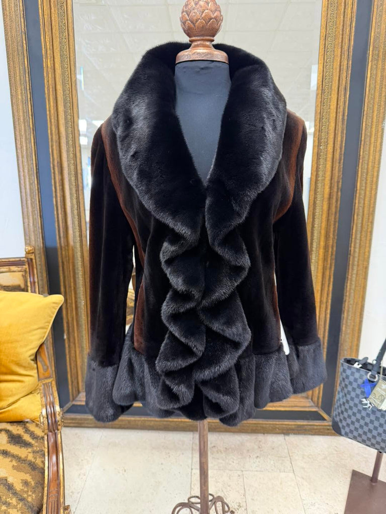 Black sheared mink with golden highlights and natural long haired mink ruffled front, hem line, and cuffs