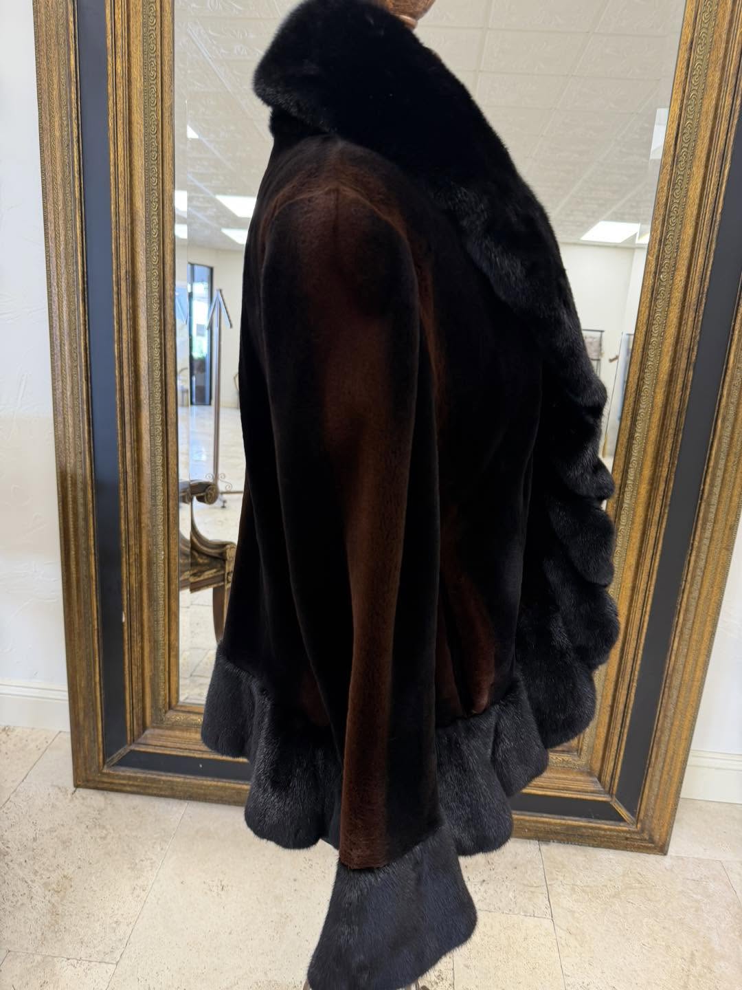Black sheared mink with golden highlights and natural long haired mink ruffled front, hem line, and cuffs